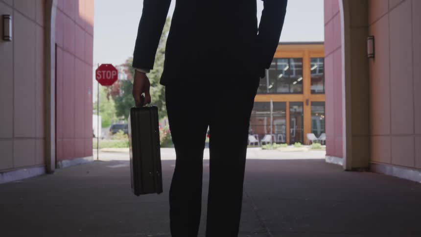 A man walking down an alley