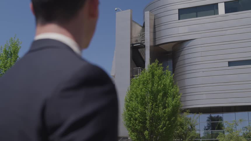 A man looking towards a building