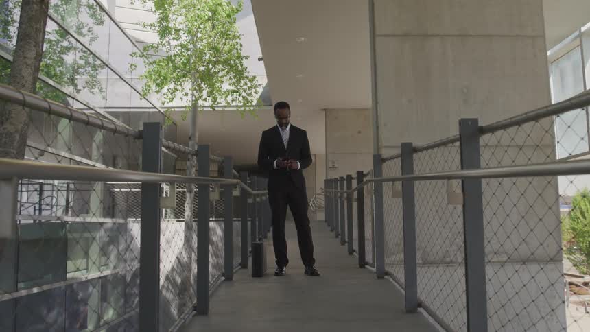 A businessman looking at his phone