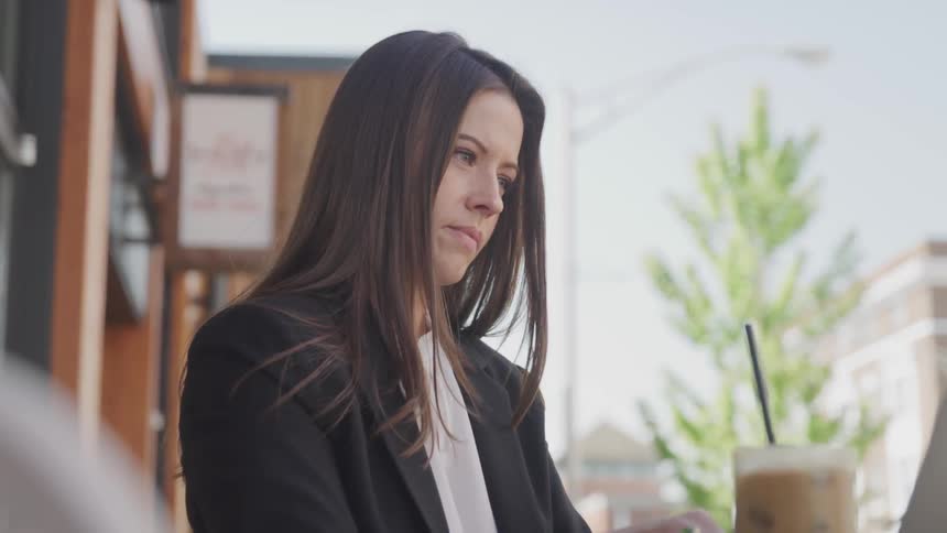 A woman works at the coffee shop