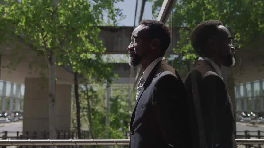A man is standing outside
