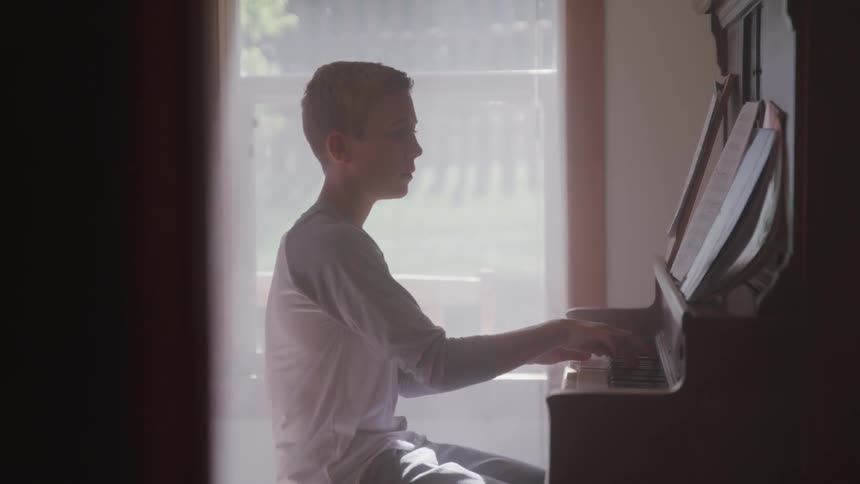 A child is playing the piano
