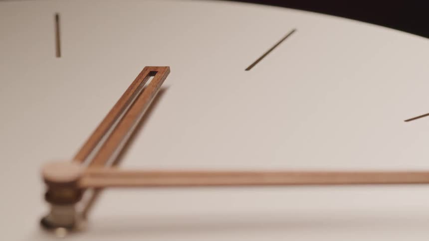 A close up view of an analog clock