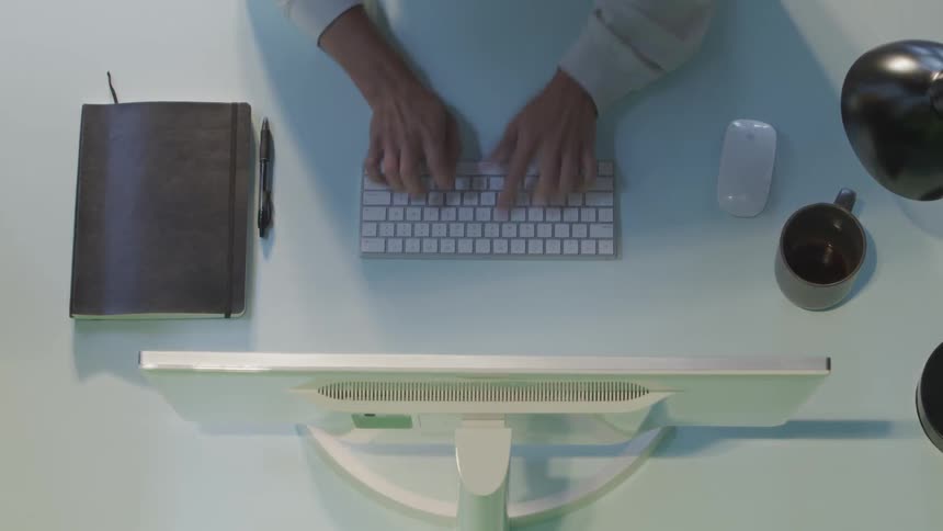 A person is typing on a keyboard