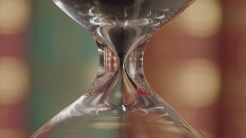 Sand falling through a hourglass