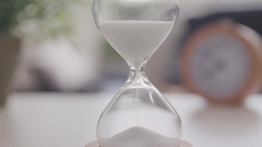 Sand is moving in an hour glass