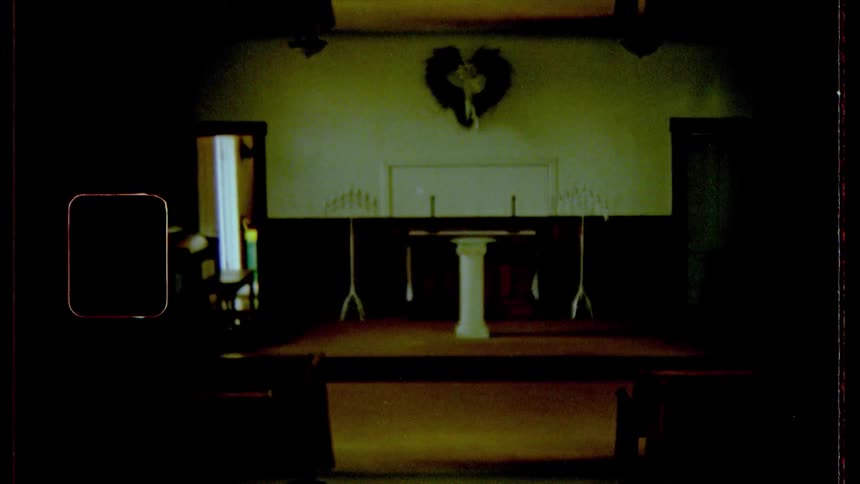 A stage with a podium with a heart above it