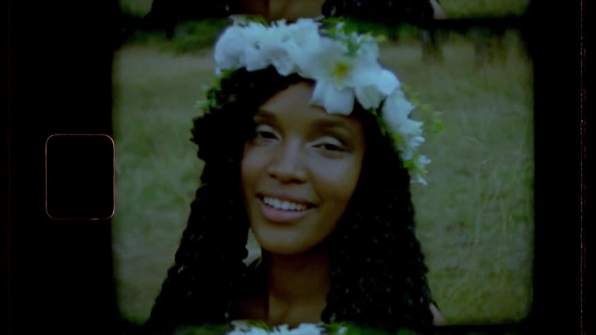 A young woman has flowers in her hair