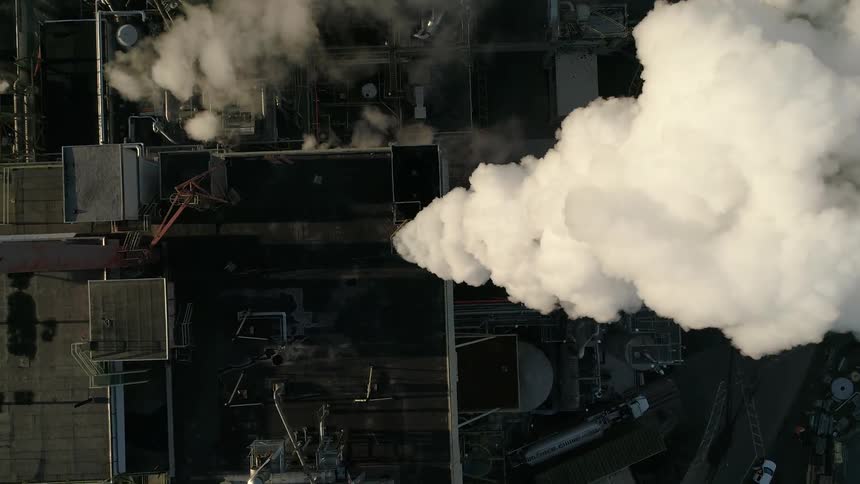 An aerial view of a factory is displayed