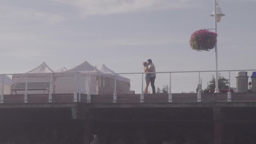 Couple kissing at the bridge
