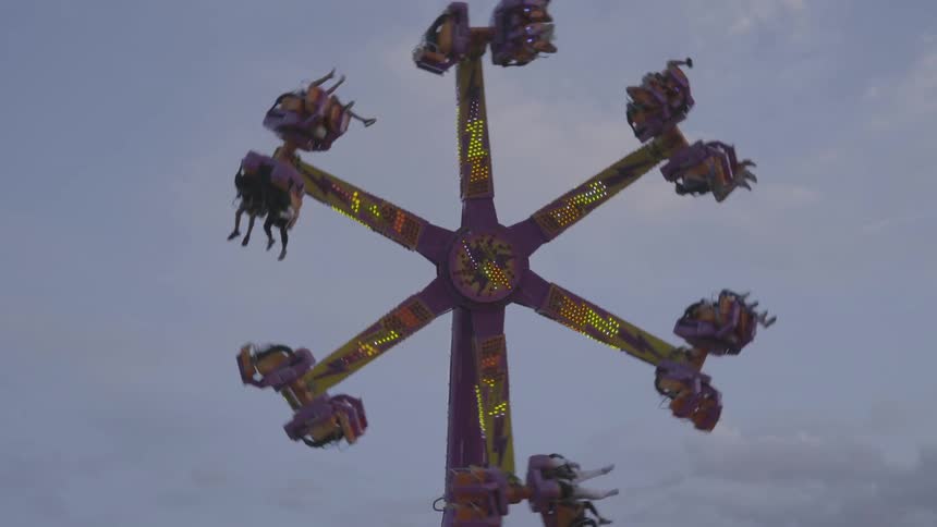 A ride spins around at a fair