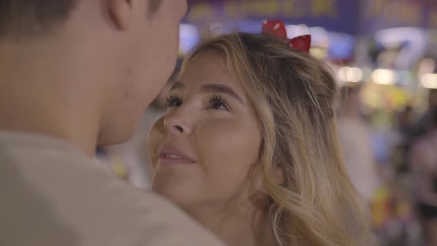 A man kissing his girlfriend forehead