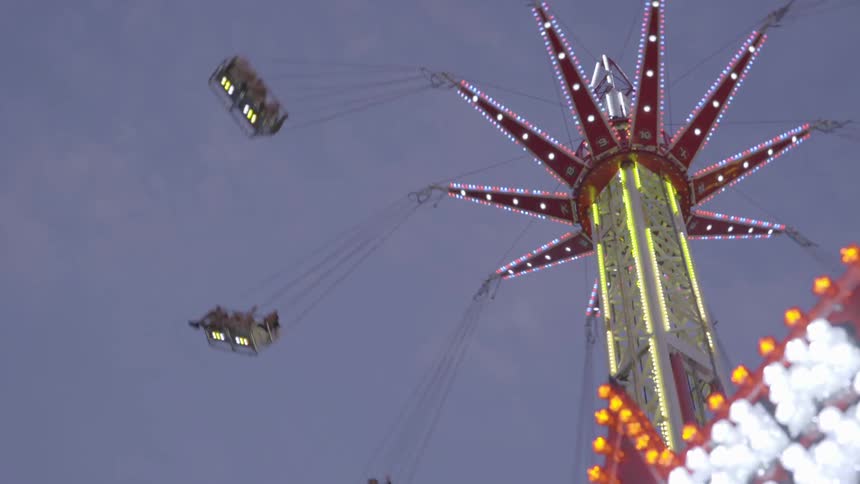 A ride spins around at an amusement park