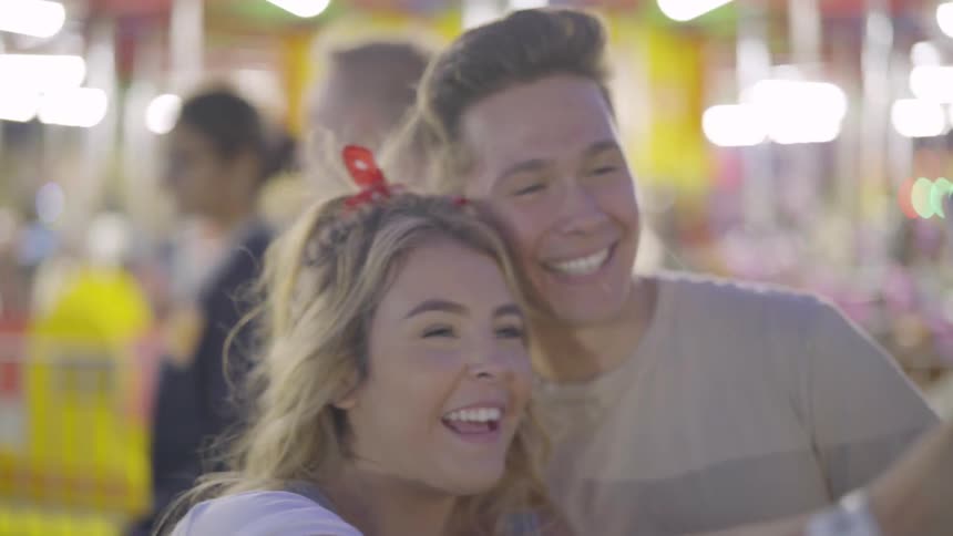 Couple taking a selfie at the amusement park
