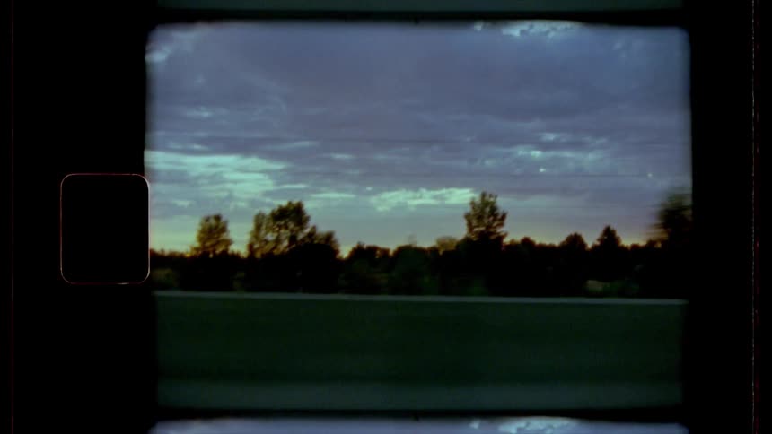Driving on a highway as cars pass in the opposite direction on the other side of the central reservation