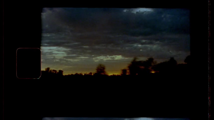 Driving down a highway at sunset