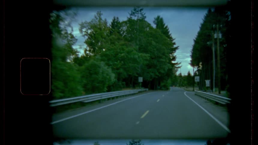 A vintage footage of a car drive in the road