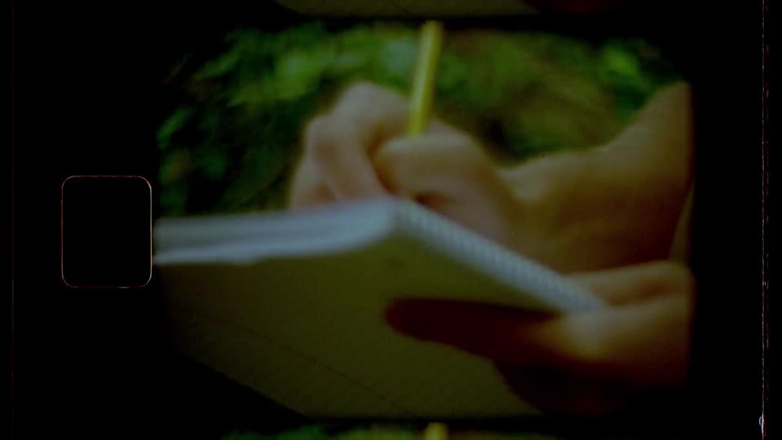 Man writes down on a notebook in the office
