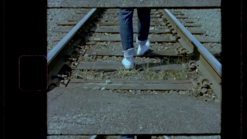 Someone walking in a train rail