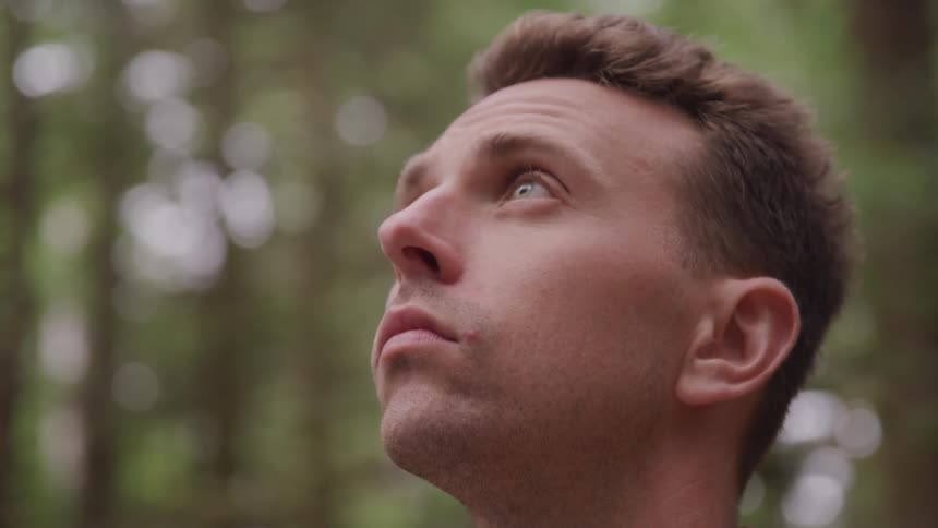 A man stares at the sky