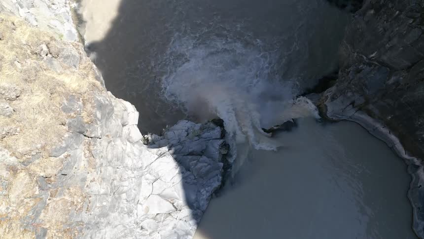 Birds eye view of a waterfall rushing down below