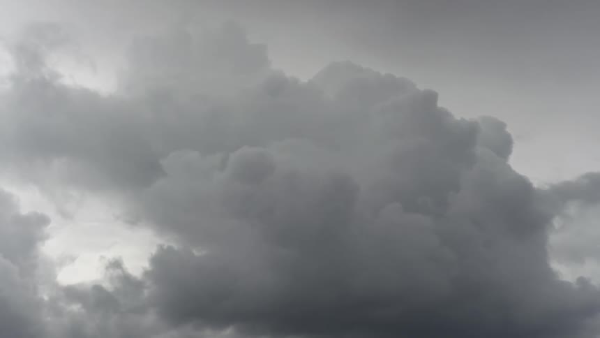 Dark clouds float in the sky