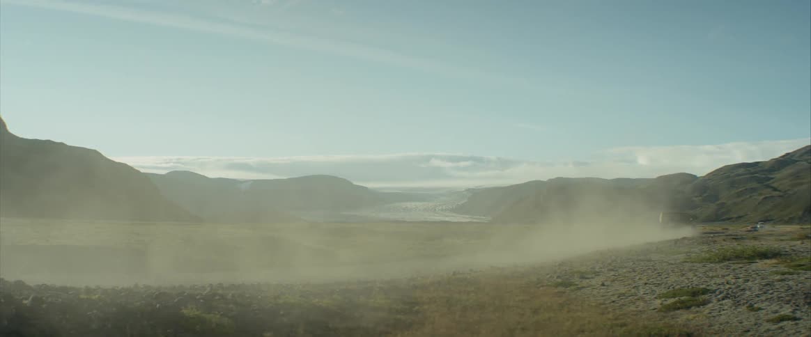 A four wheel drive car driven on a dirt road in a mountainous region