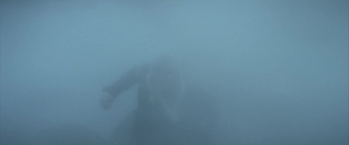 A man trying to walk through a blizzard
