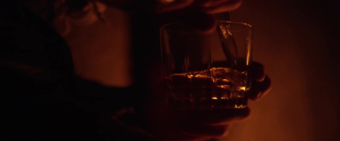 A man pouring beer to a glass