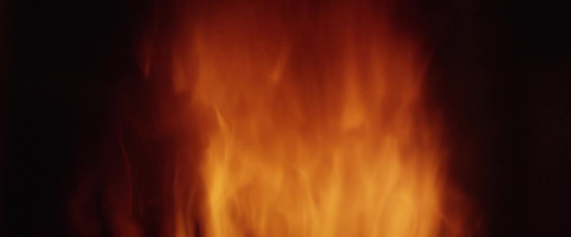 Sparks rise from orange fire