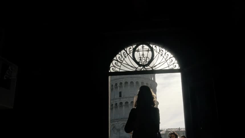 A woman is standing in a building
