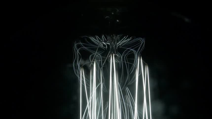 Electric device with wires and glowing filaments sways