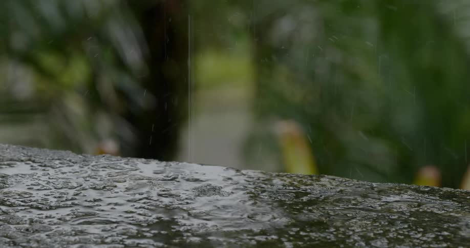 Water collects on rough stone surface outdoors