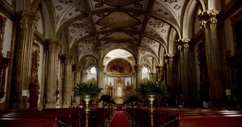 A ornate cathedral with a high ceiling and luxurious fixtures