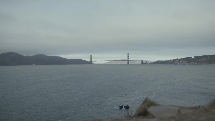 Distant view of golden gate bridge on a cloudy day