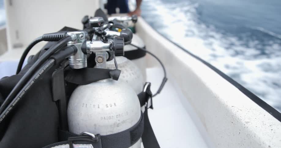 A boat carries diving tanks