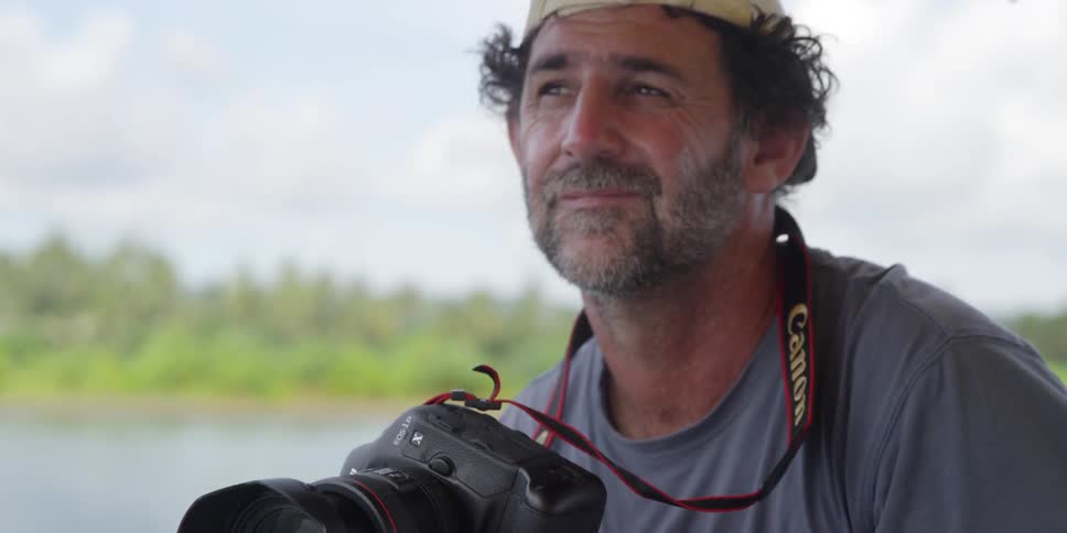 A man is taking photographs on a cloudy day