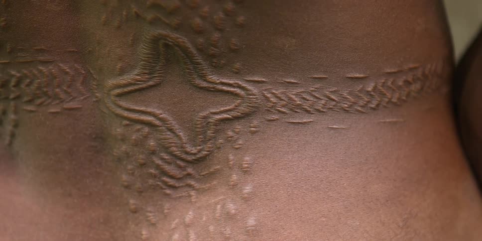 Close up of some carvings in someones back