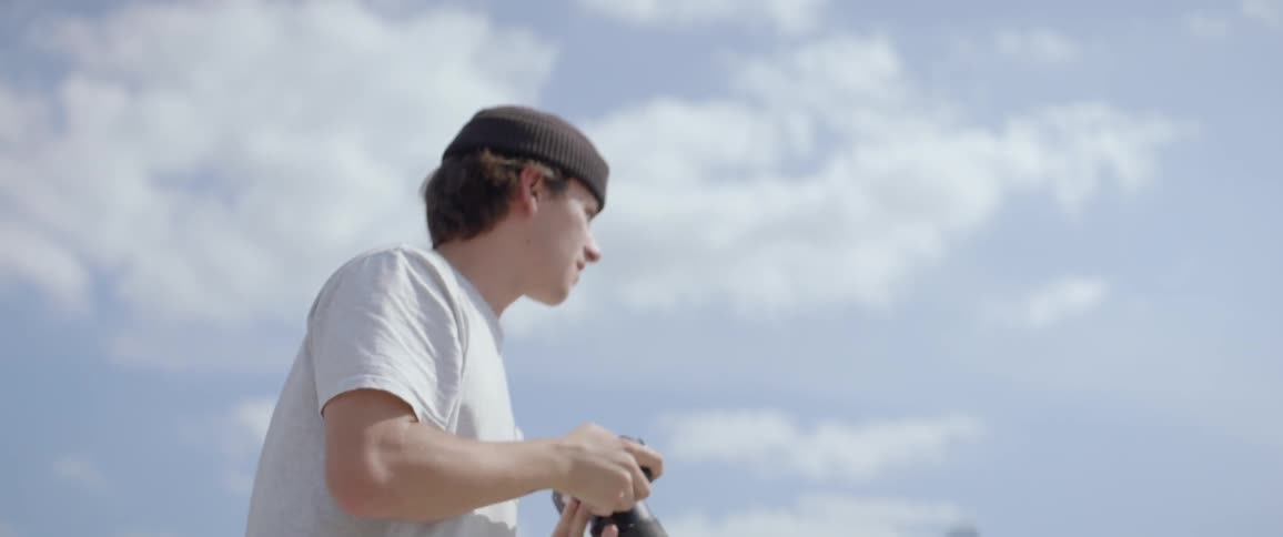 A young man takes pictures