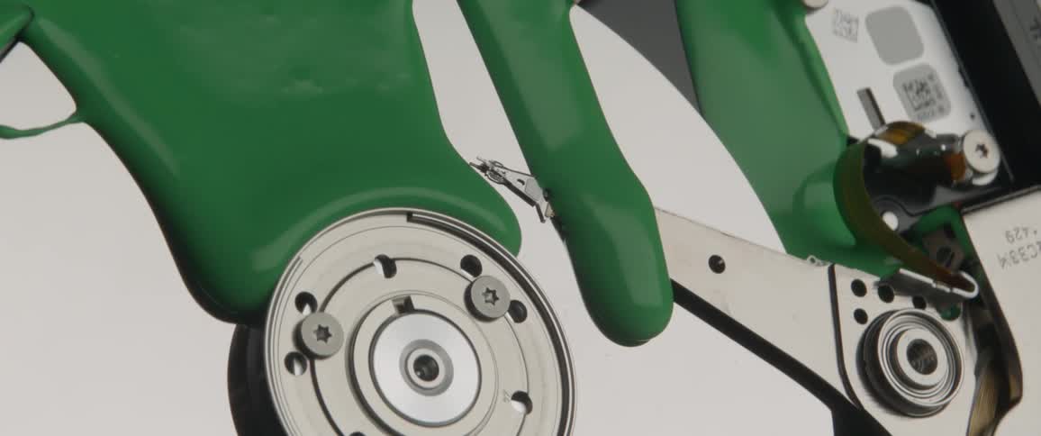 Thick green liquid spreads over the silver metal