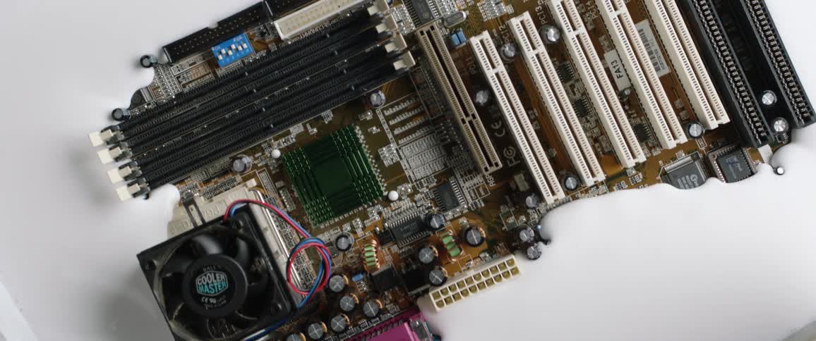 Birds eye view of a circuit board sinking in to white paint
