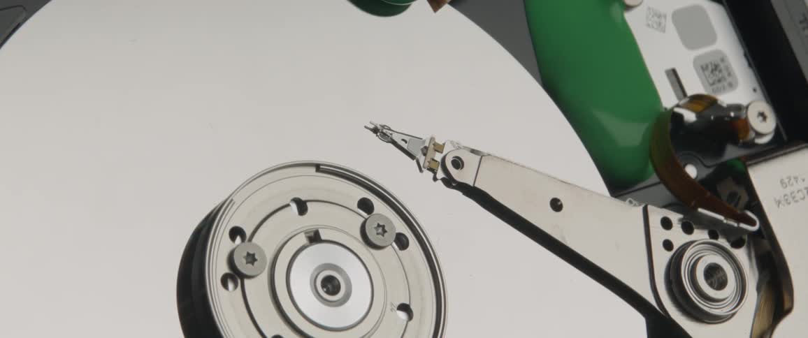 Green slime oozes down and onto a hard disk