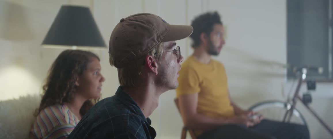 Friends play video games in living room