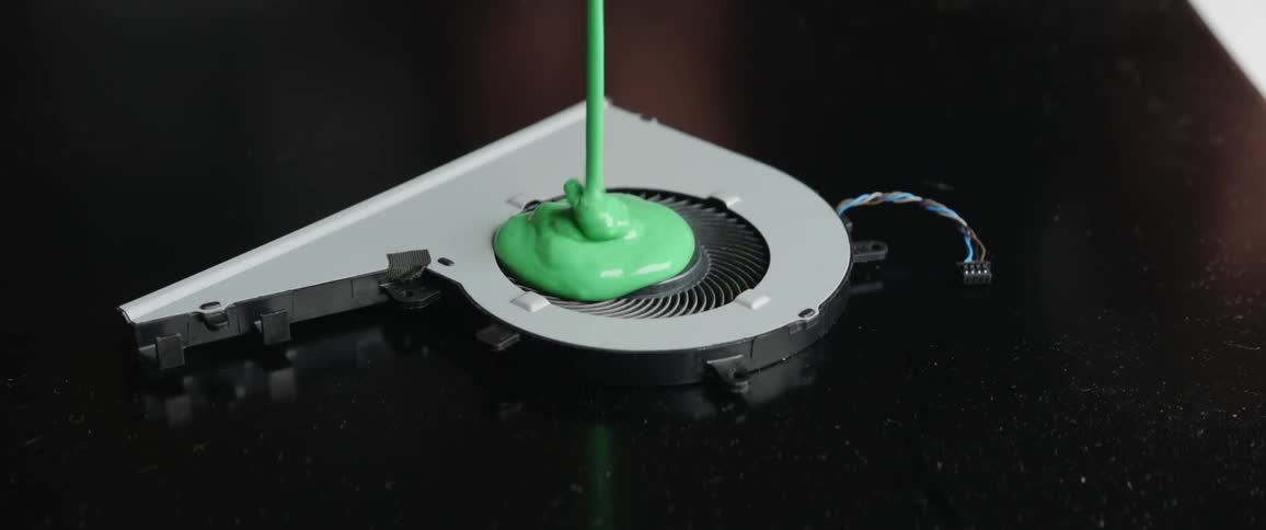 Green slime is poured over a computer hardware fan