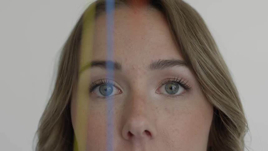 Woman observes three colored lines