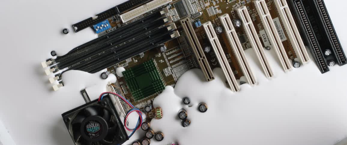 A computer motherboard sinking into a creamy white liquid