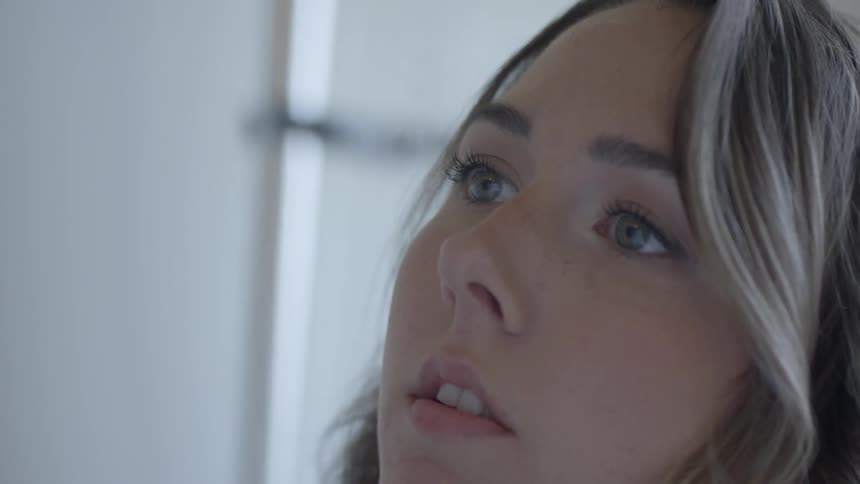 A young girl looks ahead of her