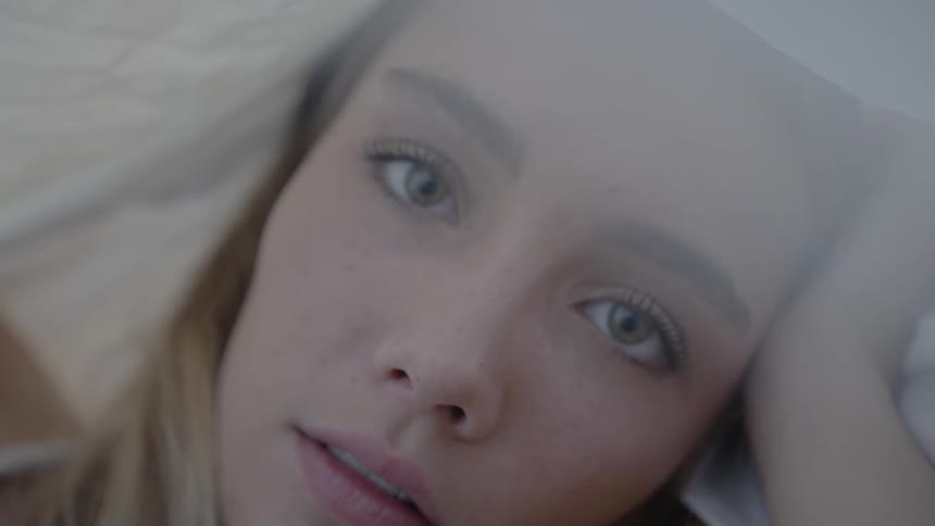 A young girl looks in to the distance