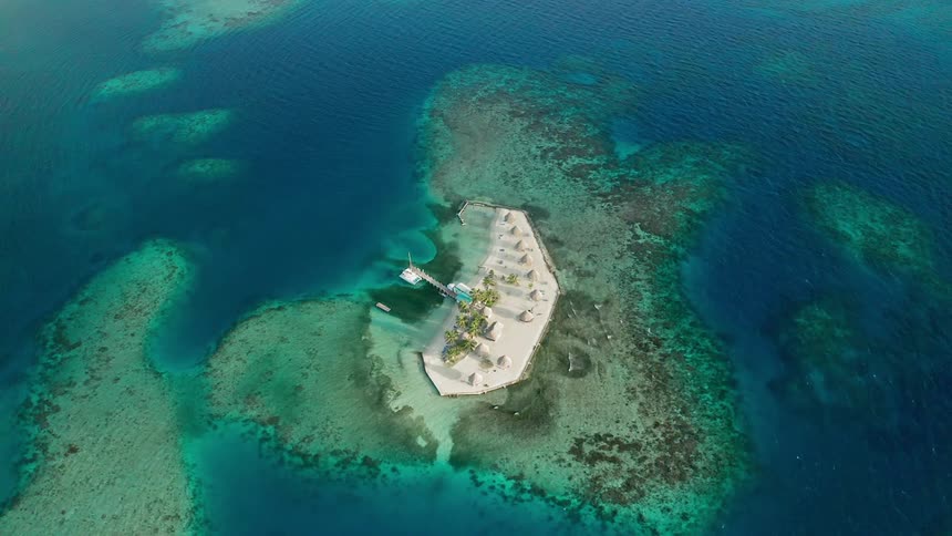 A sandy island surrounded by the ocean