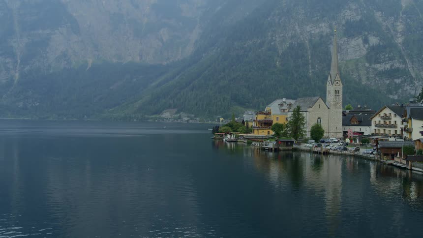 Town bordered by lake and backed by mountain